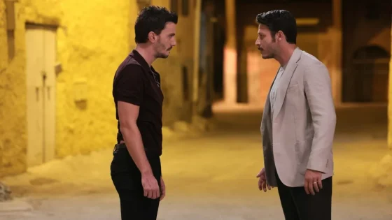 Two men face each other in a tense standoff in a yellow-lit alleyway.